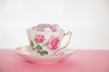 Easter chocolate mini eggs in a bone china tea cup painted with pink roses