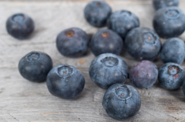Blueberries on wooden table, selective focus