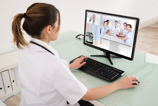 Female Doctor Video Conferencing On Digital Tablet