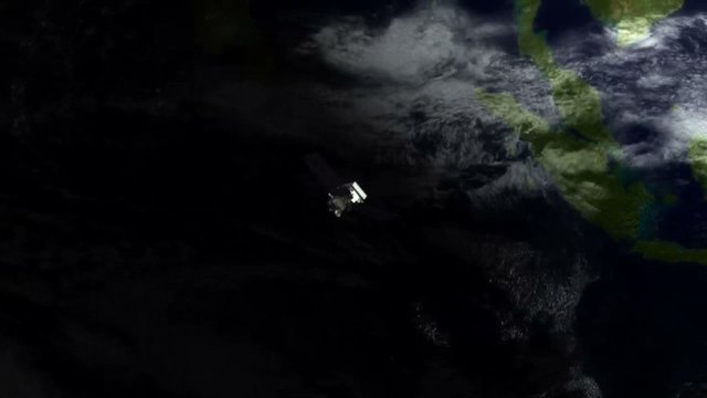 A gleaming satellite hurls through space.