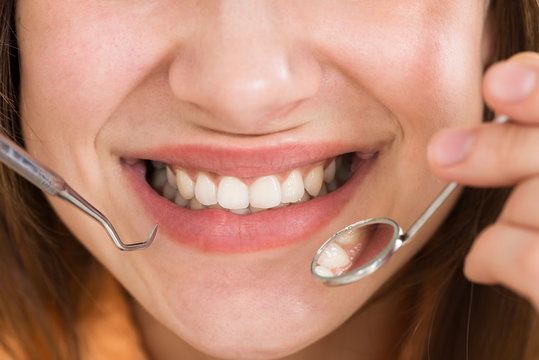 Woman Examining Her Teeth