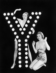 Two young women posing with the letter Y 