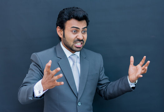 Angry businessman on isolated background
