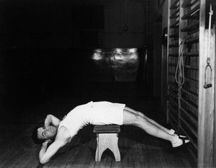 Man exercising on bench 