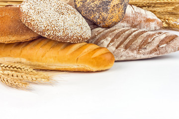 Composition with bread and rolls isolated on white