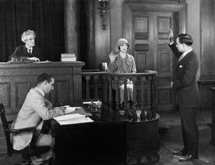 Swearing in witness in courtroom 