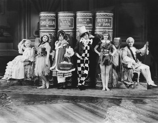 Characters from childrens stories posing with their books 