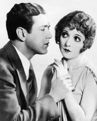 Man trying to kiss uncertain woman 