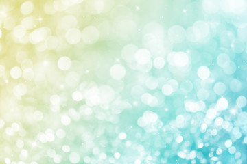 Blue and yellow ray bokeh glitter defocused lights abstract background.