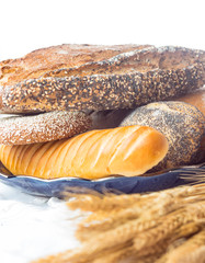 Composition with bread and rolls isolated on white