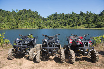 ATVs car parked lakeside