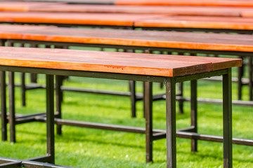 Fototapeta premium Bench in the park with green grass