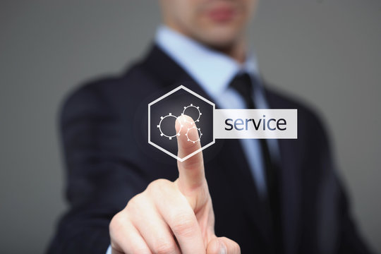 technology and internet concept - businessman pressing service button on virtual screens