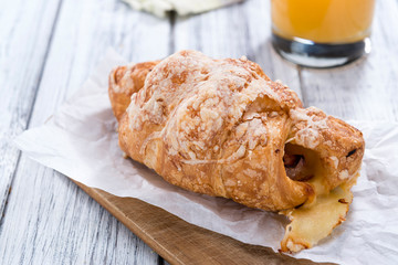 Ham and Cheese Croissant on an old wooden table