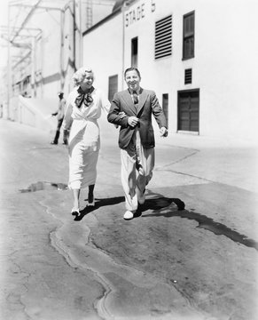 Couple Walking Together And Laughing 