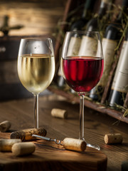 Wine bottles on the wooden shelf.