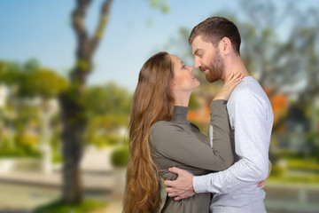 Obraz premium happy young couple looking at each other