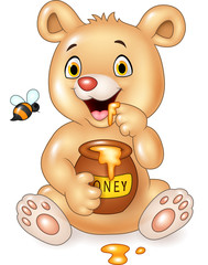 Obraz premium Cartoon funny baby bear holding honey pot isolated on white background