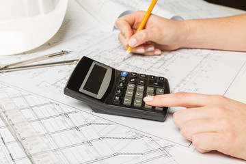 Architect working on blueprint