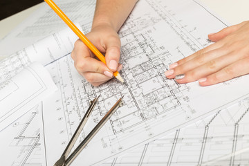 Architect working on blueprint