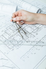 Architect working on blueprint