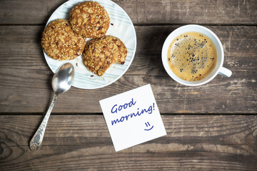 Morning coffee with cookies on a wooden table