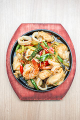 Sizzling seafood with Thai herbs.
