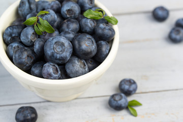 Bowl with fresh blueberries, closeup