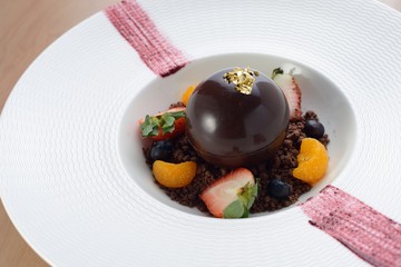 Chocolate Ball dessert with ice cream inside