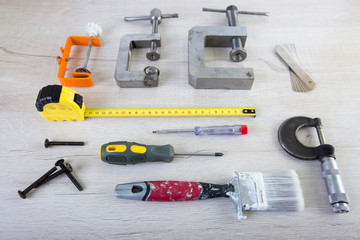 tools for carpentry and home renovation hanging on a pegboard with copy space