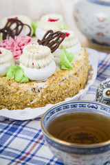 Cake with cream and tea
