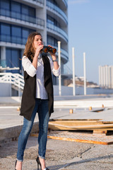 Business woman with a pair of binoculars