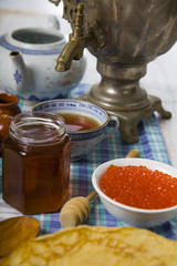 Pancakes with caviar on the table