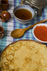 Pancakes with caviar on the table