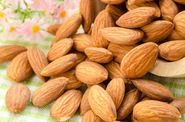 Almonds pour from wood Cup
