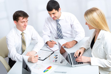 Fototapeta premium Young businessman with colleagues