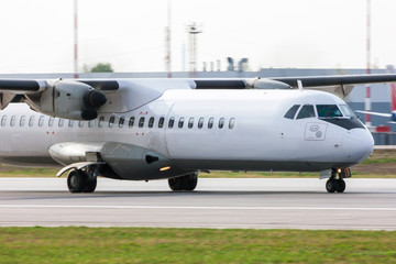 Close up of a taxiing turboprop aircraft