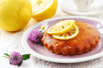 Homemade lemon cake decorated with slices of lemon