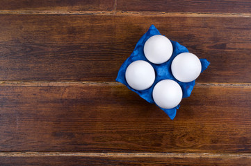 White eggs in navy blue container