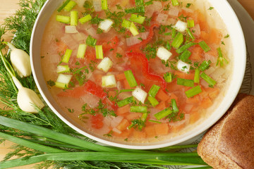 Grunge vintage still life.
Cup of coffee and flaky pastries on parchment.