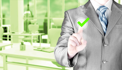 business man touching, pressing modern button with green ticking Check Box.