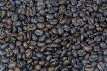 Brown coffee beans, close-up of coffee beans for background and texture