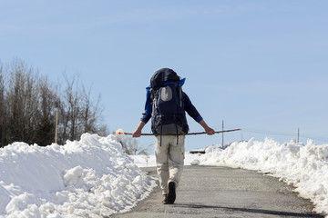 pilgrim in winter with snow  in way of St James,  Camino de  Santiago, Compostela, Spain