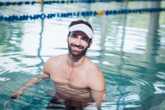 Smiling man doing underwater bike