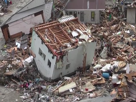 Search and rescue teams hunt for survivors following the devastating earthquake and tsunami in Japan in 2012