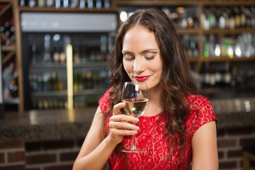 Pretty woman having a glass of wine
