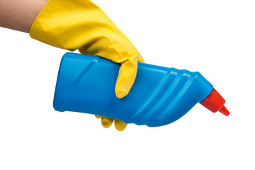 Hand with yellow glove holding cleaning product