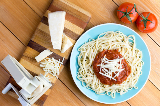 Pasta press with gruyere cheese and spaghetti
