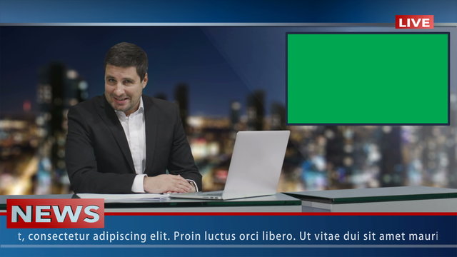 Media broadcaster is sitting at a table and talking. Display with Green Screen. News show Mock-up.