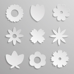 Paper origami flowers on gray background